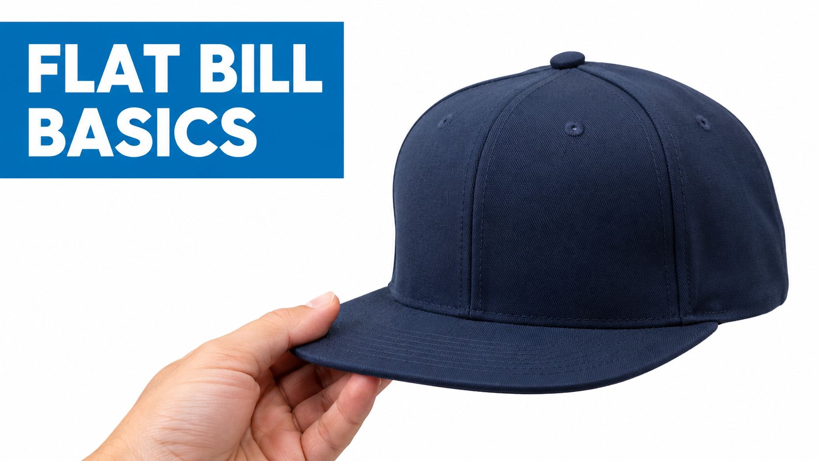 A hand holding a navy blue flat bill baseball cap against a white background with text.