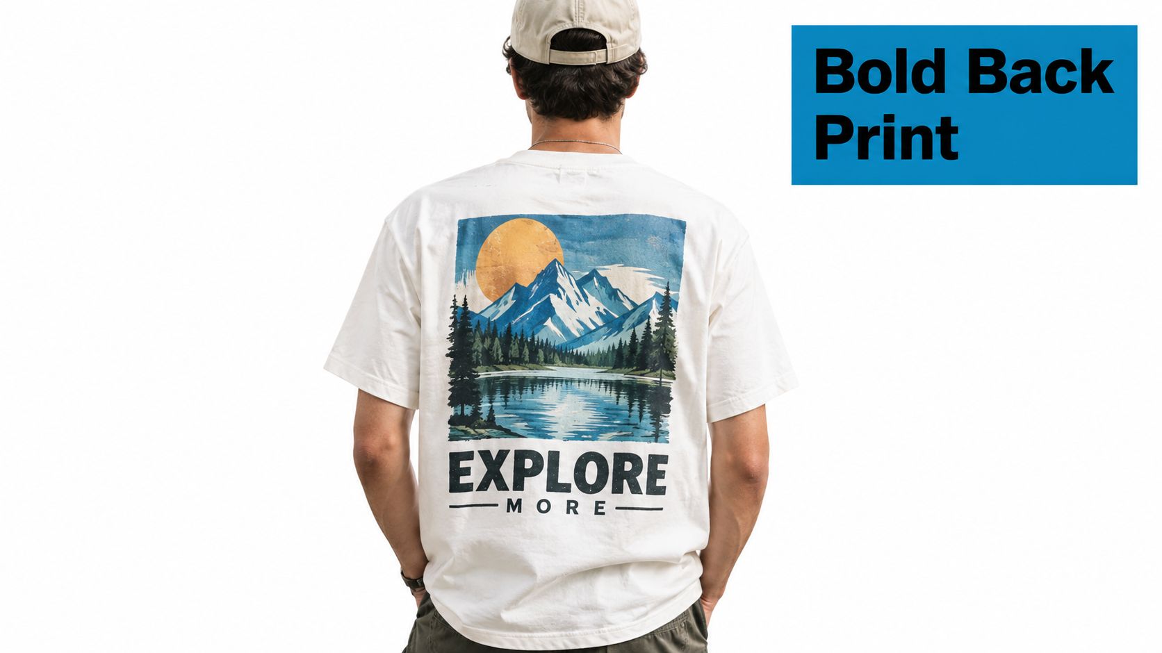 A person wearing a white t-shirt with a vintage landscape print of mountains and a lake.
